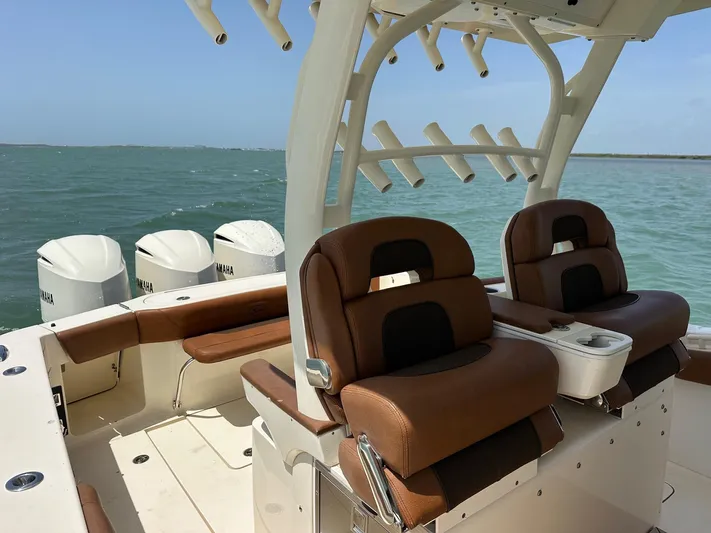  Yacht Photos Pics 2015 Scout 350 LXF boat interior with brown seats and Yamaha engines.
