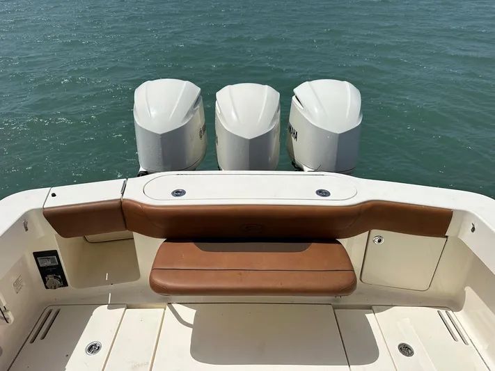  Yacht Photos Pics 2015 Scout 350 LXF boat with triple Yamaha outboard engines on calm water.