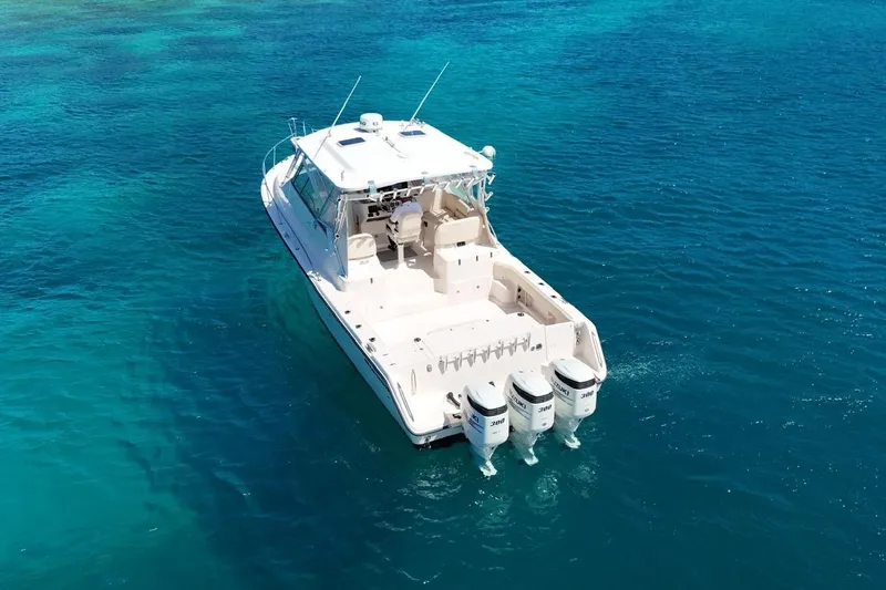  Yacht Photos Pics 2006 Grady-White Express 360 boat on clear blue ocean water.