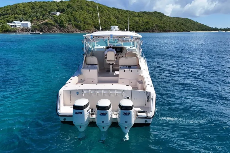  Yacht Photos Pics 2006 Grady-White Express 360 boat with triple 300 HP engines on blue water.