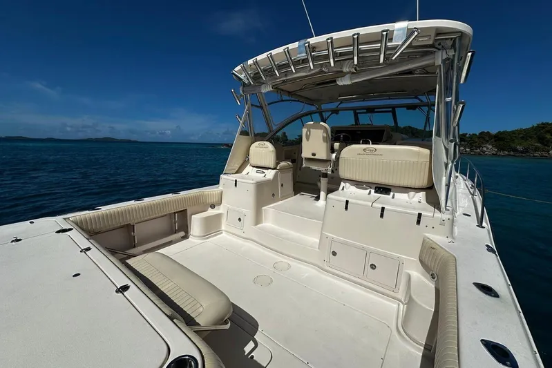  Yacht Photos Pics 2006 Grady-White Express 360 boat on calm blue water, featuring spacious deck and seating.