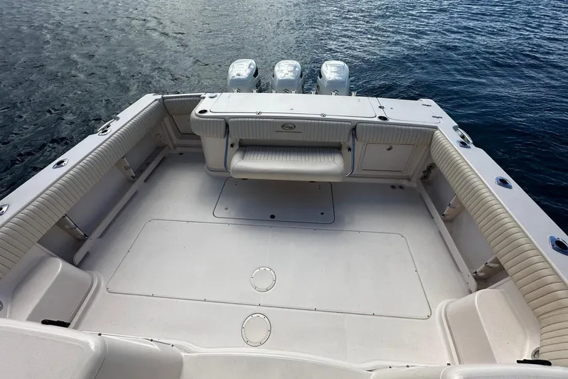  Yacht Photos Pics 2006 Grady-White Express 360 boat deck with triple outboard motors on water.