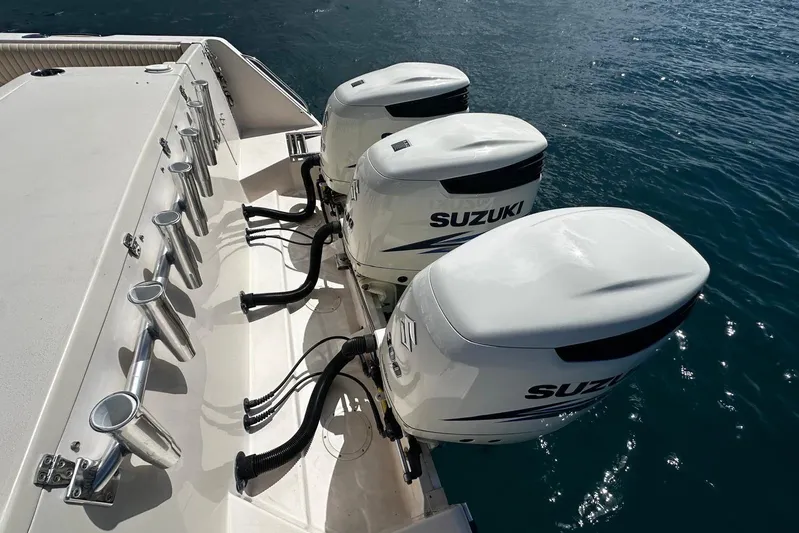  Yacht Photos Pics 2006 Grady-White Express 360 boat with triple Suzuki outboard motors on the water.