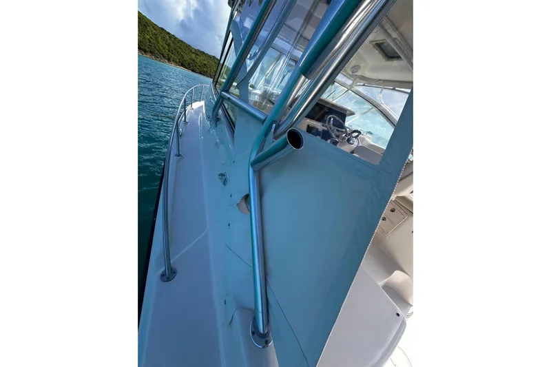  Yacht Photos Pics 2006 Grady-White Express 360 boat, side view, on calm blue water.