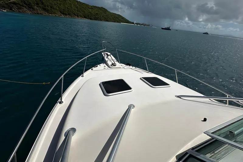  Yacht Photos Pics 2006 Grady-White Express 360 boat on calm waters, scenic coastal view.