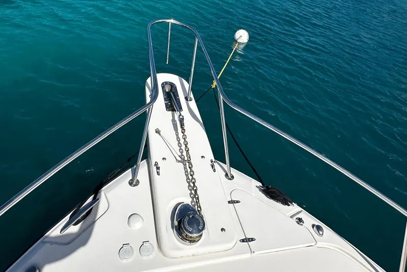  Yacht Photos Pics Bow of 2006 Grady-White Express 360 boat on clear blue water.