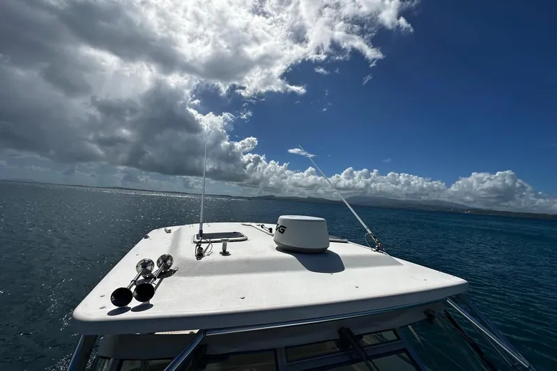  Yacht Photos Pics 2006 Grady-White Express 360 boat on open sea under cloudy sky.