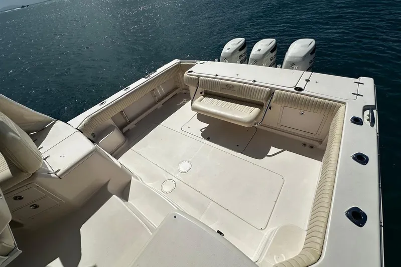  Yacht Photos Pics 2006 Grady-White Express 360 boat deck with seating and triple outboard motors.