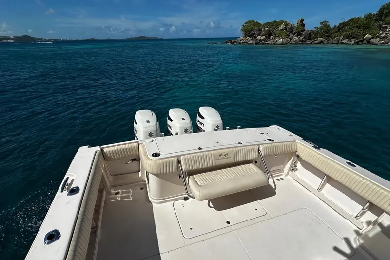  Yacht Photos Pics 2006 Grady-White Express 360 boat with triple engines on clear blue water.