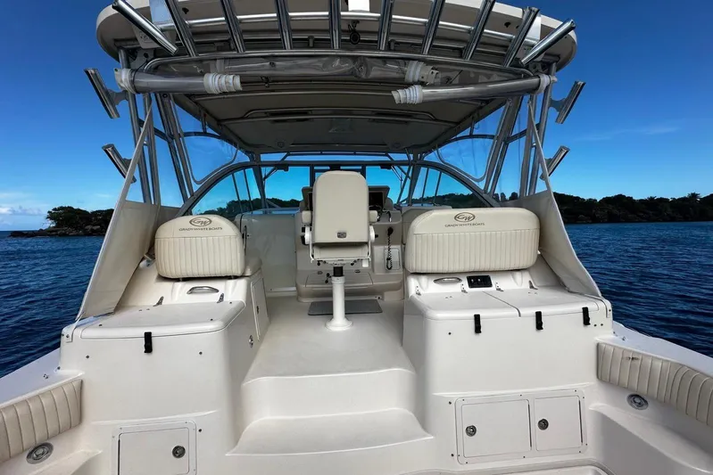  Yacht Photos Pics 2006 Grady-White Express 360 boat interior with seating, ocean backdrop.