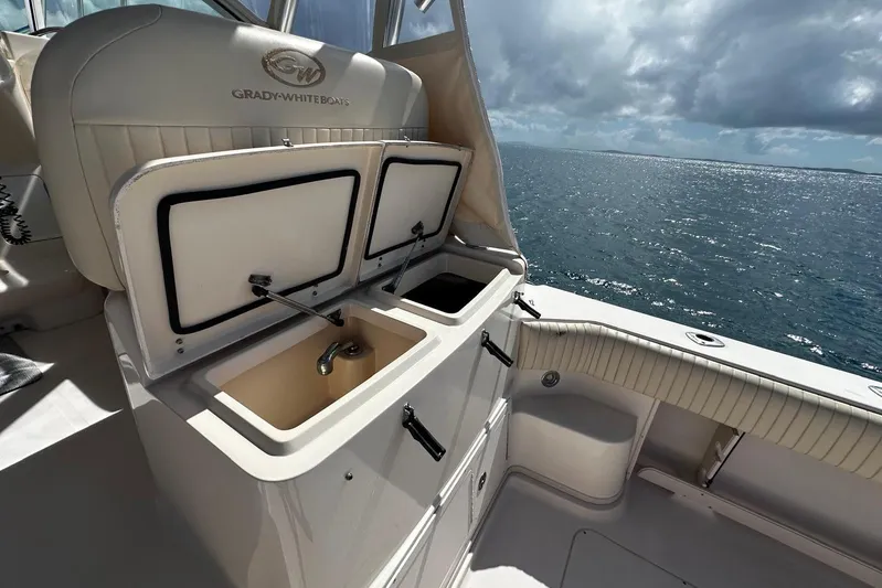  Yacht Photos Pics 2006 Grady-White Express 360 boat interior with open storage compartments, ocean view.