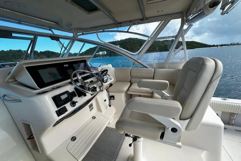  Yacht Photos Pics 2006 Grady-White Express 360 boat interior with helm, seating, and scenic water view.