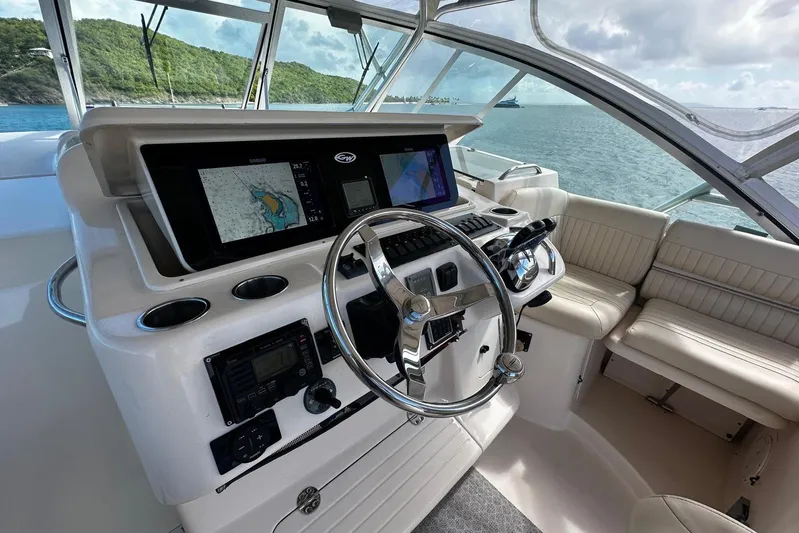  Yacht Photos Pics Helm of 2006 Grady-White Express 360 boat with navigation screens and steering wheel.