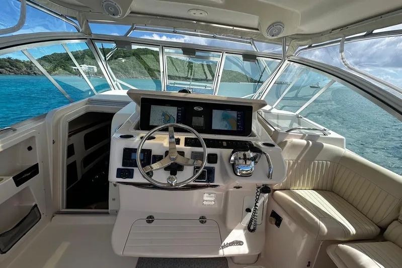  Yacht Photos Pics 2006 Grady-White Express 360 helm with navigation screens, steering wheel, and ocean view.