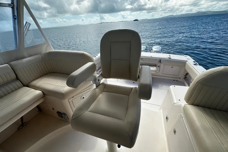 Yacht Photos Pics 2006 Grady-White Express 360 boat interior with seating, overlooking calm ocean waters.