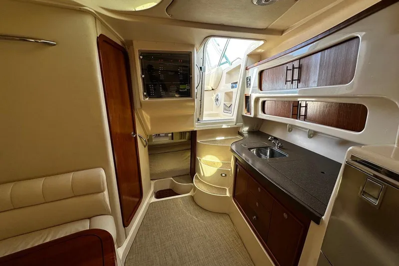  Yacht Photos Pics 2006 Grady-White Express 360 cabin interior with kitchenette and seating area.