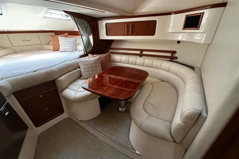  Yacht Photos Pics Luxurious 2006 Grady-White Express 360 cabin interior with plush seating and elegant wood finishes.