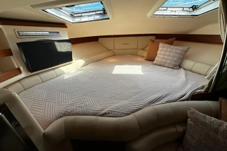  Yacht Photos Pics Luxurious cabin interior of 2006 Grady-White Express 360 with cozy bedding and skylights.