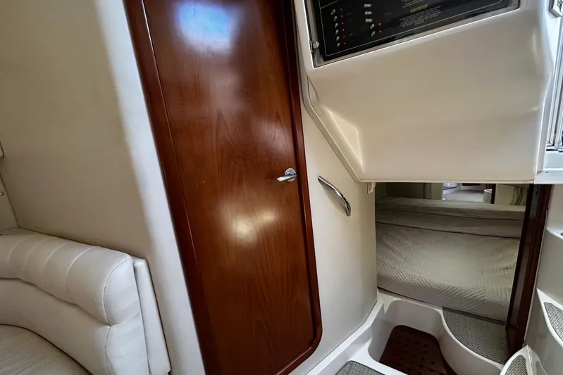  Yacht Photos Pics 2006 Grady-White Express 360 cabin interior with wooden door and control panel.