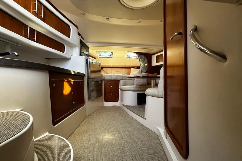  Yacht Photos Pics Luxurious interior of 2006 Grady-White Express 360 boat with elegant wood finishes.