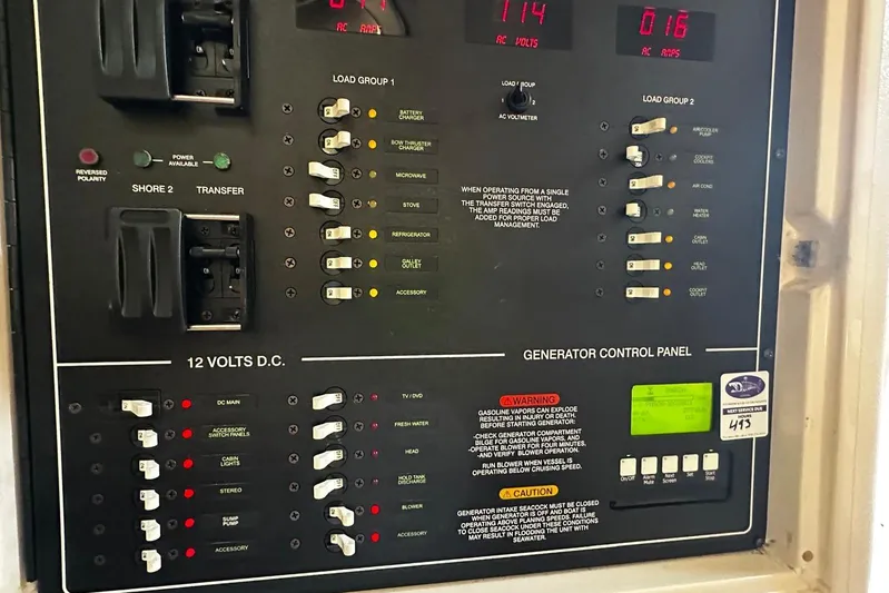  Yacht Photos Pics Electrical control panel on a 2006 Grady-White Express 360 boat, showing various switches and warnings.