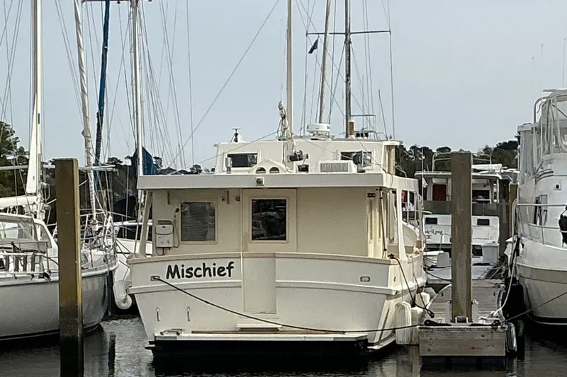  Yacht Photos Pics 2009 Hugh Huff Custom Pilothouse Trawler "Mischief" docked at marina.