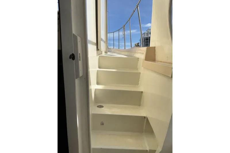  Yacht Photos Pics Staircase on 2009 Hugh Huff Custom Pilothouse Trawler, leading to deck with railing.