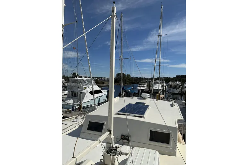 Yacht Photos Pics 2009 Hugh Huff Custom Pilothouse Trawler with solar panel, docked at marina.
