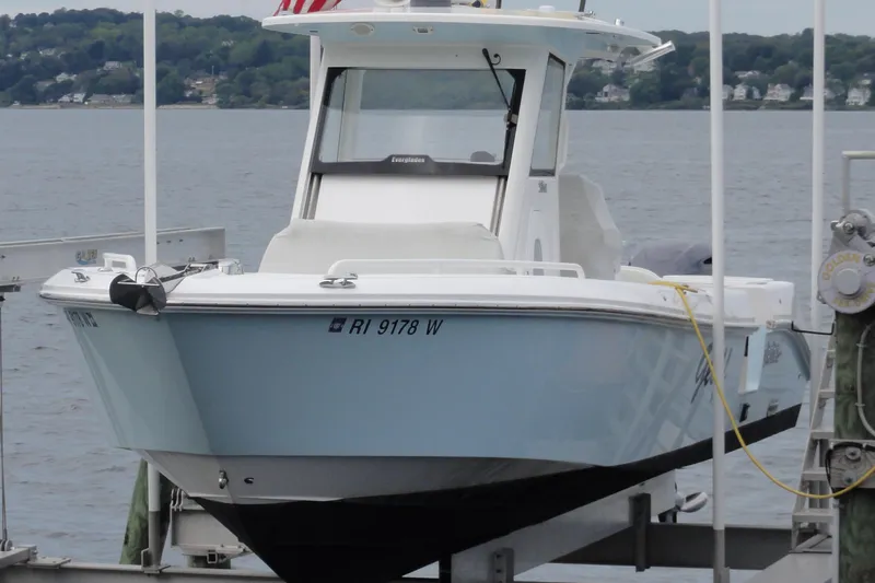  Yacht Photos Pics 2016 Everglades 295 Center Console boat docked by the water.