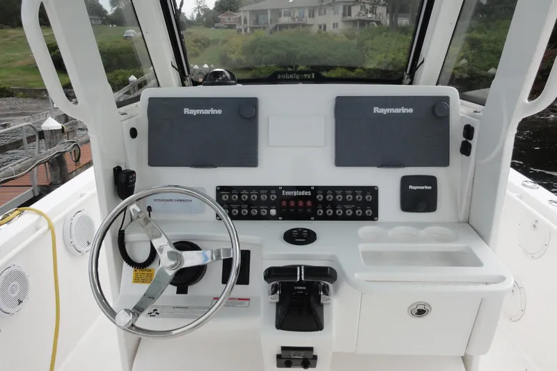  Yacht Photos Pics 2016 Everglades 295 Center Console boat dashboard with Raymarine electronics and steering wheel.