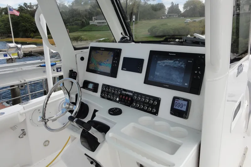 Yacht Photos Pics 2016 Everglades 295 Center Console boat dashboard with navigation screens and controls.