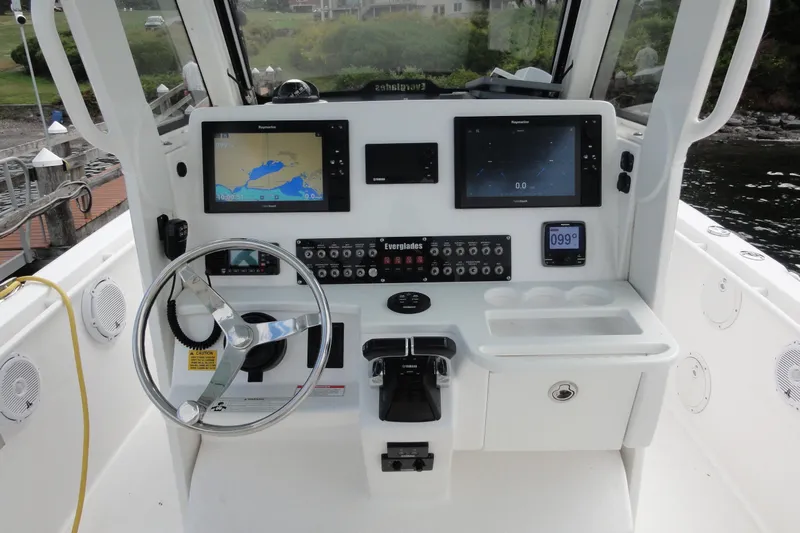  Yacht Photos Pics 2016 Everglades 295 Center Console boat dashboard with navigation screens and controls.