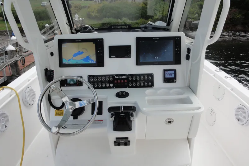  Yacht Photos Pics 2016 Everglades 295 Center Console boat dashboard with navigation screens and controls.