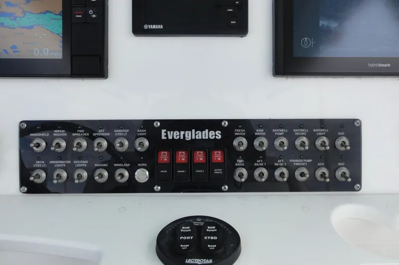  Yacht Photos Pics Control panel of 2016 Everglades 295 Center Console boat with various switches and displays.