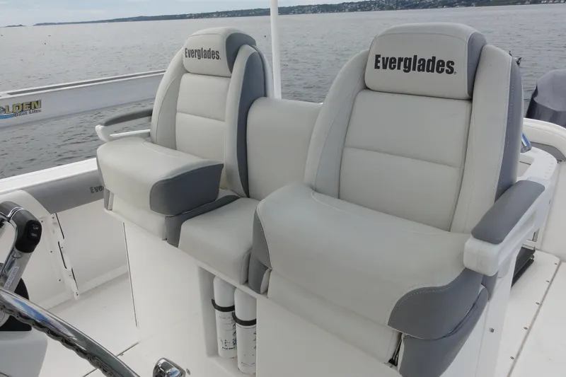  Yacht Photos Pics 2016 Everglades 295 Center Console boat seats with armrests on a calm water backdrop.