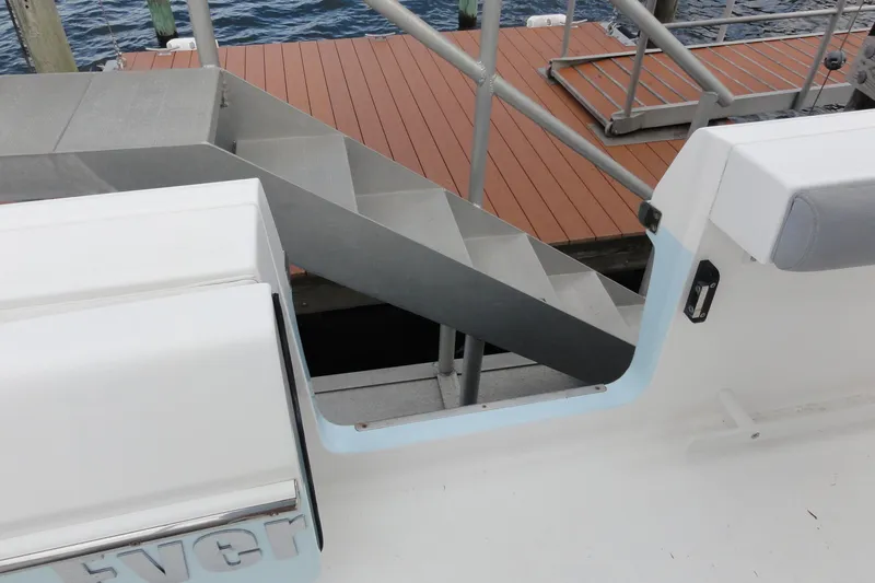  Yacht Photos Pics 2016 Everglades 295 Center Console boat near dock with metal stairs.