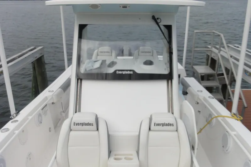  Yacht Photos Pics 2016 Everglades 295 Center Console boat docked, showcasing sleek design and seating.