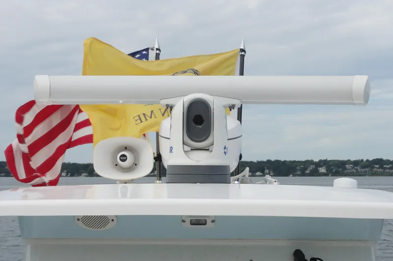  Yacht Photos Pics 2016 Everglades 295 Center Console with radar and flags on open water.