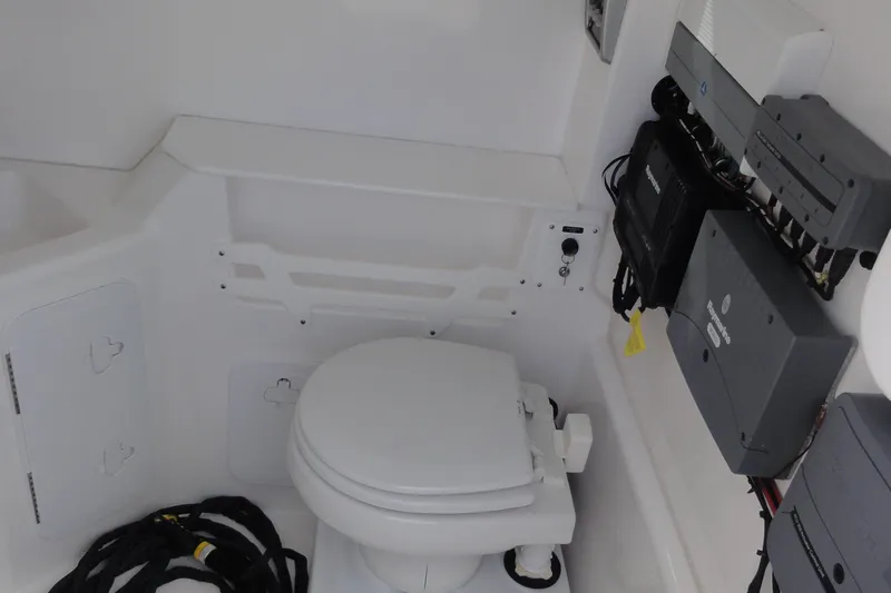  Yacht Photos Pics Interior of 2016 Everglades 295 Center Console boat with marine toilet and equipment.