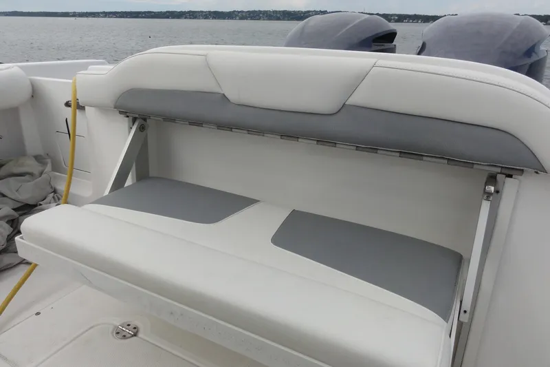  Yacht Photos Pics 2016 Everglades 295 Center Console boat with foldable rear seating, ocean view in background.