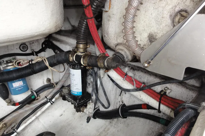  Yacht Photos Pics Engine compartment of a 2016 Everglades 295 Center Console with visible wiring and hoses.