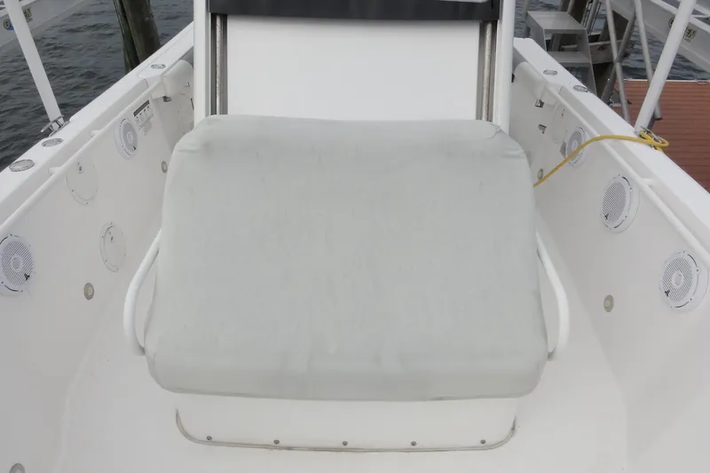  Yacht Photos Pics 2016 Everglades 295 Center Console boat seat with white cushion and surrounding speakers.