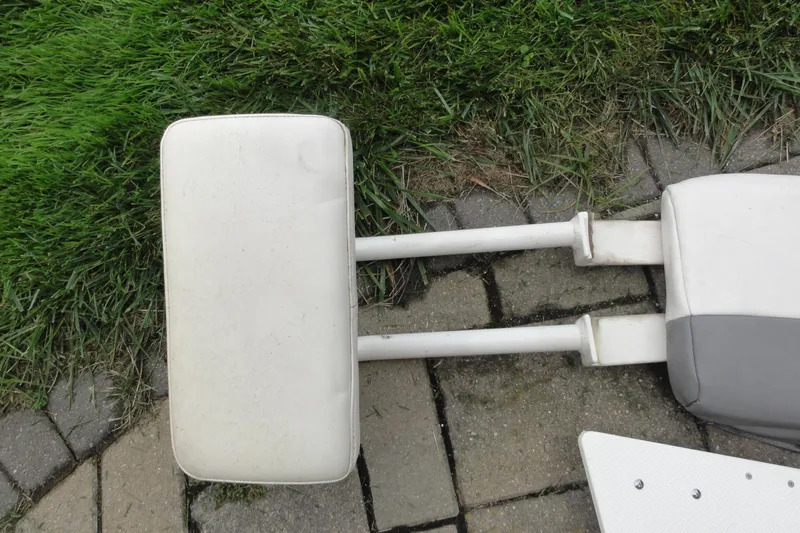  Yacht Photos Pics Boat seat backrest on grass and stone, Everglades 295 Center Console, 2016 model.