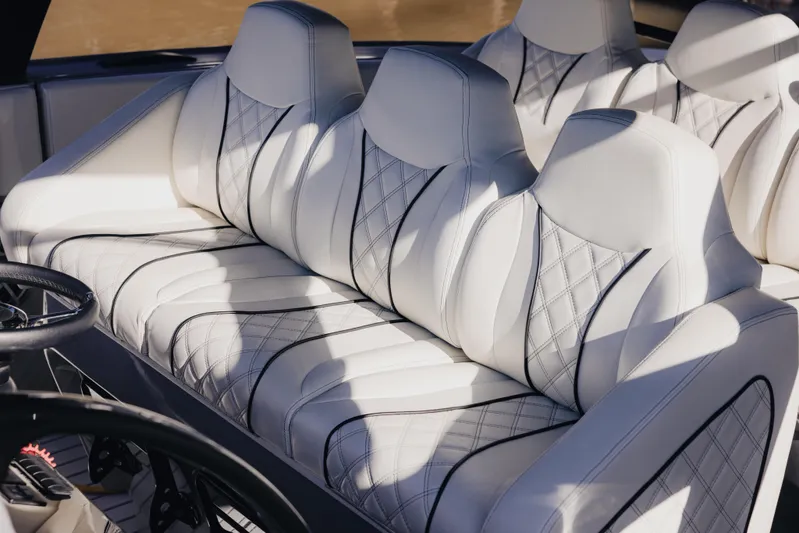  Yacht Photos Pics Luxurious white seating in a 2021 Midnight Express 43 Open boat interior.