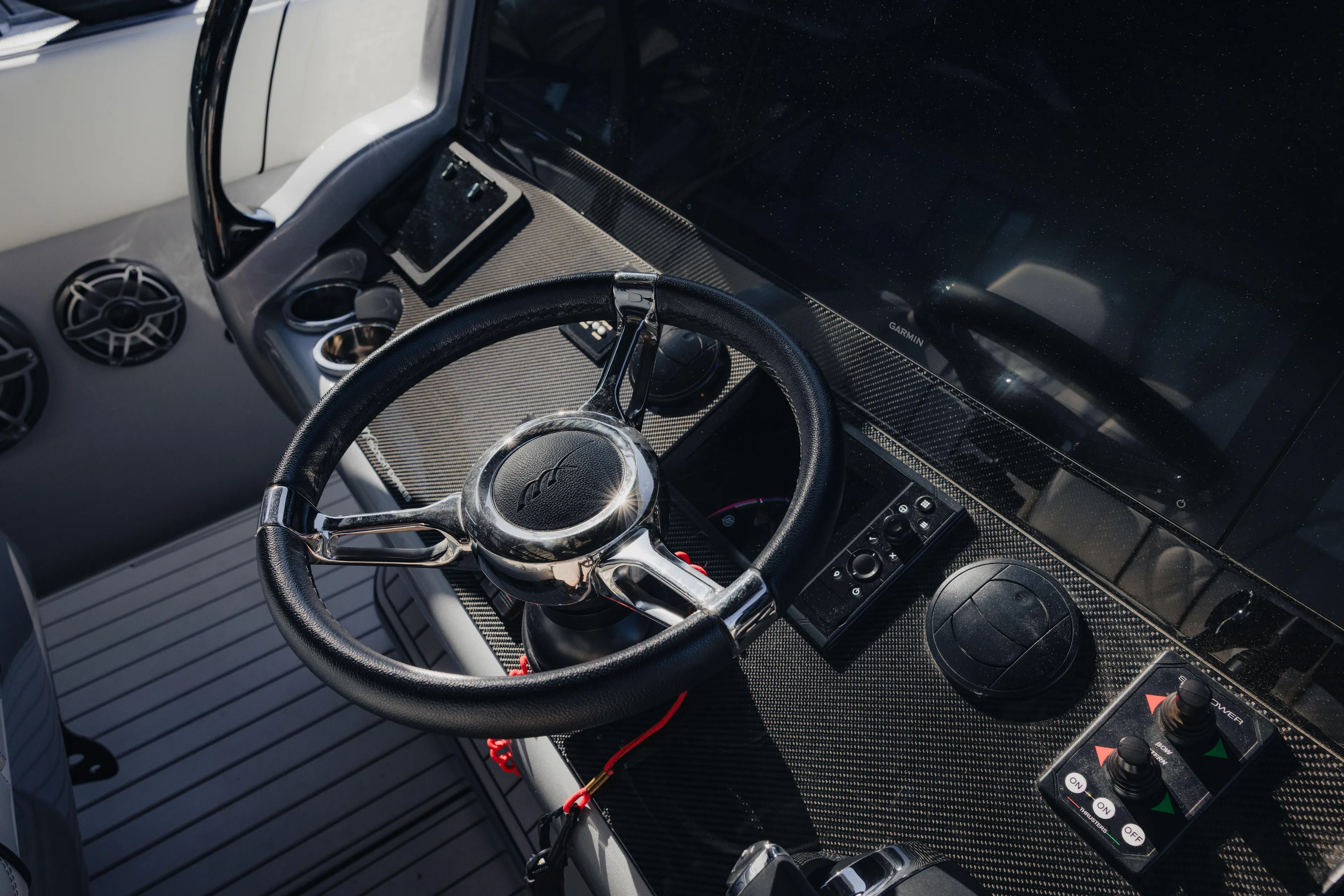  Yacht Photos Pics Steering wheel and controls of 2021 Midnight Express 43 Open boat cockpit.