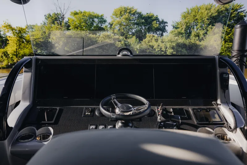  Yacht Photos Pics Cockpit of 2021 Midnight Express 43 Open boat with steering wheel and control panel.