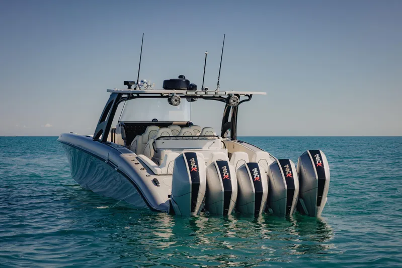  Yacht Photos Pics 2021 Midnight Express 43 Open boat with five powerful outboard engines on the ocean.