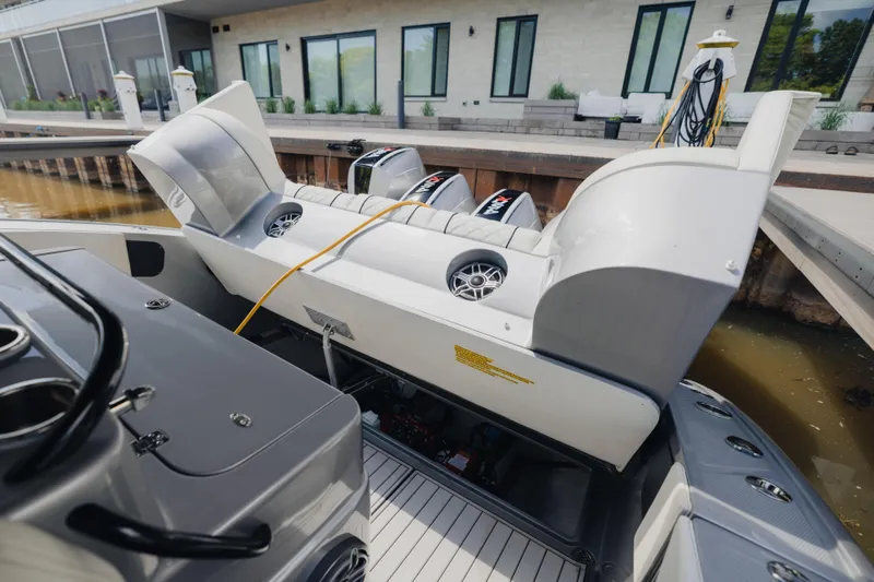  Yacht Photos Pics 2021 Midnight Express 43 Open boat with open engine compartment at dockside.