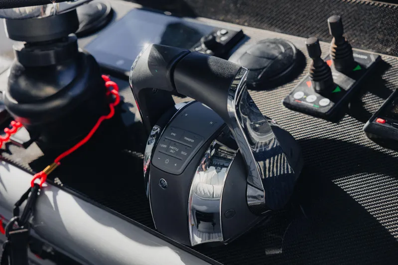  Yacht Photos Pics Control panel of a 2021 Midnight Express 43 Open boat, featuring modern throttle and joystick controls.