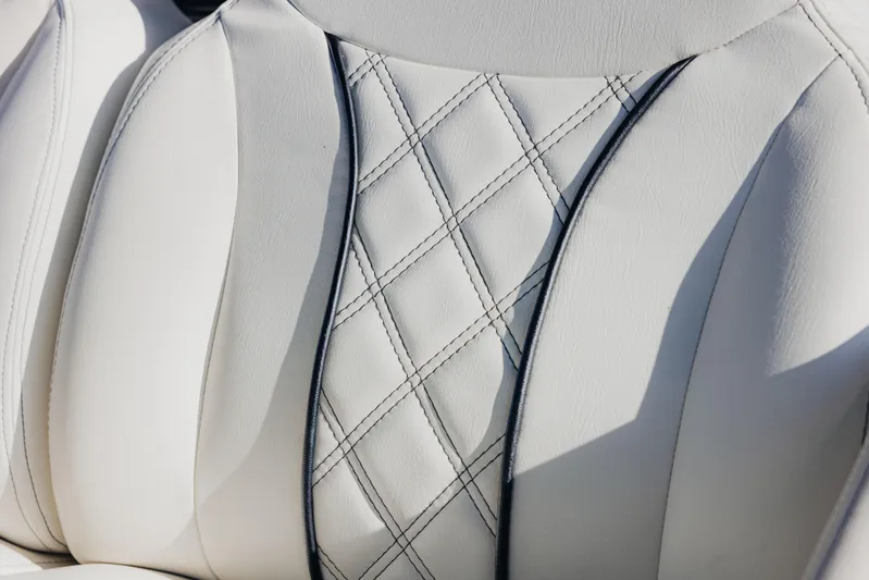  Yacht Photos Pics Luxurious white leather seat with diamond stitching in a 2021 Midnight Express 43 Open.